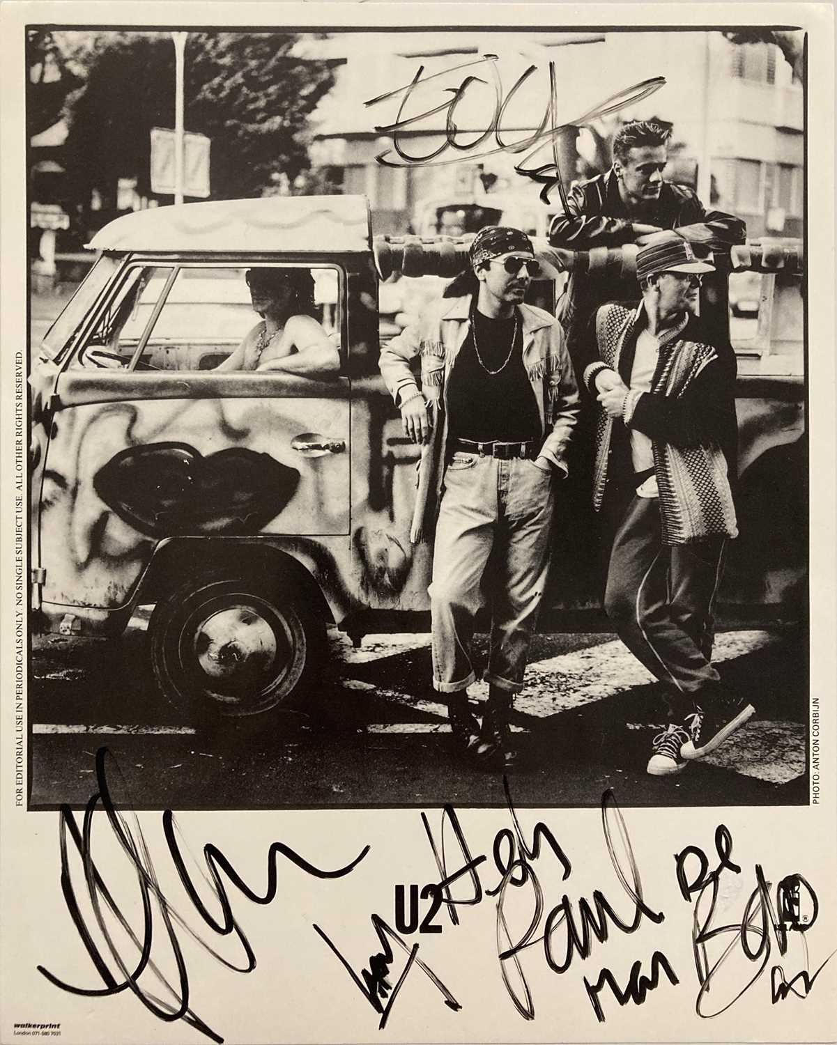 Lot 201 - FULLY SIGNED U2 PHOTOGRAPH.