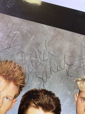 Lot 197 - DEPECHE MODE - A SIGNED PHOTOGRAPH.