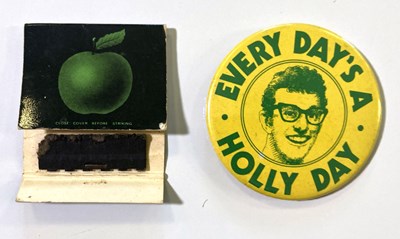 Lot 233 - APPLE MATCHBOOK AND BUDDY HOLLY WEEK BADGE.
