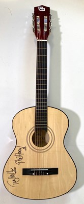 Lot 348 - THE SPECIALS - AN ACOUSTIC GUITAR SIGNED BY TERRY HALL.