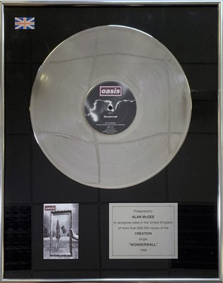 Lot 279 - OASIS - A FRAMED AWARD SIGNED BY ALAN MCGEE.