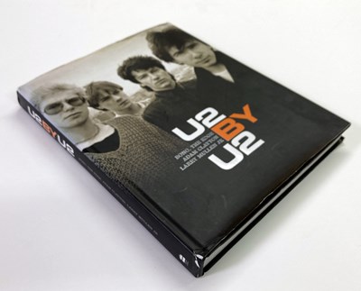 Lot 321 - U2 - SIGNED BOOK.