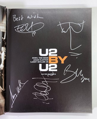 Lot 321 - U2 - SIGNED BOOK.