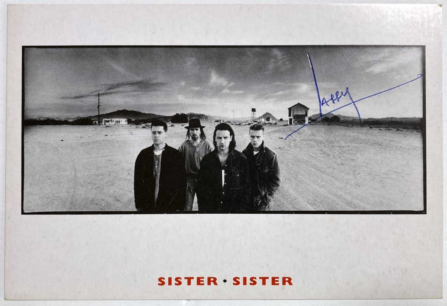 Lot 312 U2 BAND SIGNED POSTCARDS.
