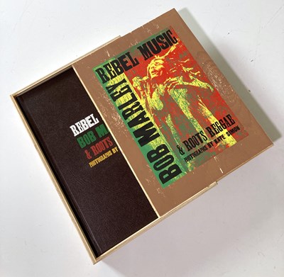Lot 79 - BOB MARLEY REBEL MUSIC GENESIS PUBLICATIONS - DELUXE COPY SIGNED BY ERIC CLAPTON.