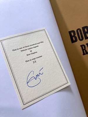 Lot 79 - BOB MARLEY REBEL MUSIC GENESIS PUBLICATIONS - DELUXE COPY SIGNED BY ERIC CLAPTON.