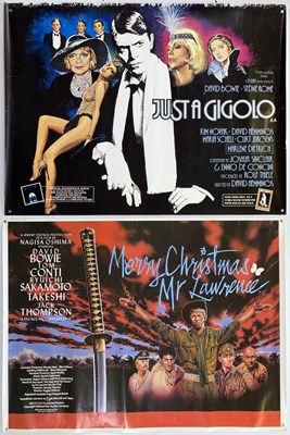 Lot 125 - JUST A GIGOLO / MERRY CHRISTMAS MR LAWRENCE QUAD POSTERS.