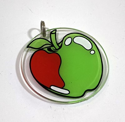 Lot 164 - THE APPLE BOUTIQUE - AN ORIGINAL KEY RING.