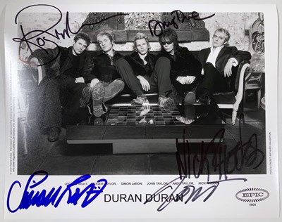 Lot 339 - DURAN DURAN - A SIGNED PROMOTIONAL PHOTO.