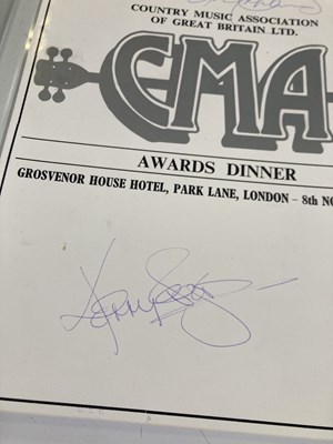 Lot 369 - KENNY ROGERS - A SALES AWARD AND A SIGNED BOOKLET.