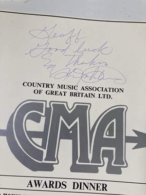 Lot 369 - KENNY ROGERS - A SALES AWARD AND A SIGNED BOOKLET.