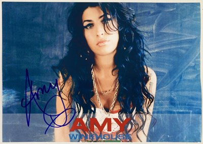 Lot 349 - AMY WINEHOUSE - A SIGNED 10 X 8".