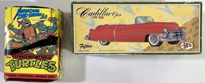 Lot 84 - TEENAGE MUTANT NINJA TURTLES COMPLETE BOX OF UNOPENED TOPPS CARDS / A CADILLAC 'FIFTIES' CAR.