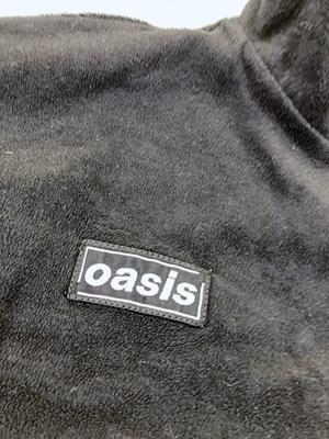 Lot 134 - OASIS - TOSHIBA BRANDED FLEECE AND 2000 TOUR ITINERARY.