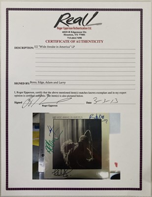 Lot 296 - U2 - A FULLY SIGNED LP.