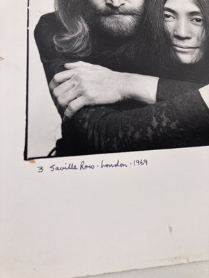 Lot 115 - THE BEATLES - JOHN LENNON / YOKO ONO - SIGNED PRINT BY IAIN MACMILLAN.