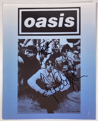 Lot 487 - OASIS - IMAGE SIGNED BY LIAM / NOEL GALLAGHER.
