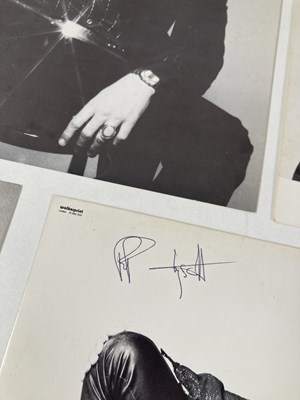 Lot 332 - THIN LIZZY - PROMOTIONAL PHOTOGRAPHS - TWO SIGNED BY PHIL LYNOTT.