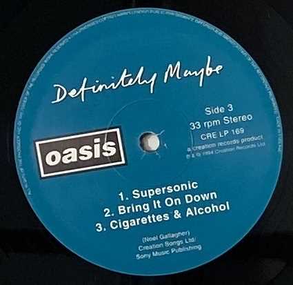 Lot 58 - OASIS - DEFINITELY MAYBE/ WHAT'S THE STORY