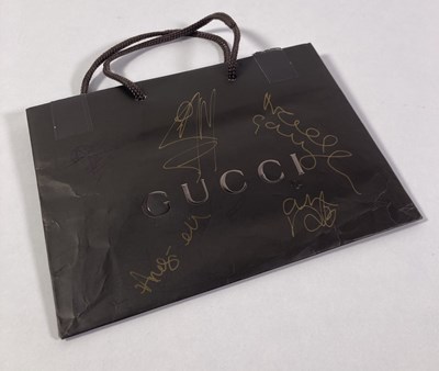Lot 500 - OASIS - FULLY SIGNED GUCCI BAG.