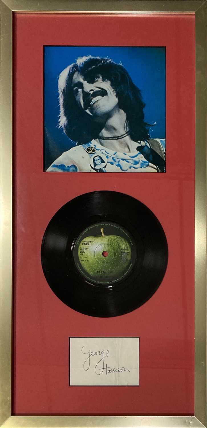 Lot 145 - THE BEATLES - A CUTTING SIGNED BY GEORGE HARRISON.