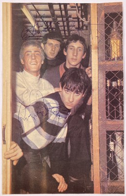 Lot 310 - THE WHO - A FULLY SIGNED MAGAZINE CUTTING INC KEITH MOON.