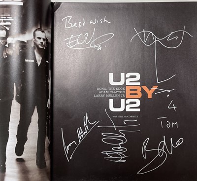 Lot 331 - U2 - FULLY SIGNED BOOK FROM BARNES AND NOBLE SIGNING SESSION.