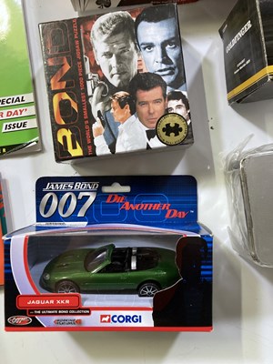 Lot 190 - JAMES BOND COLLECTABLES INC FILM CEL / CORGI / SWATCH WATCH.