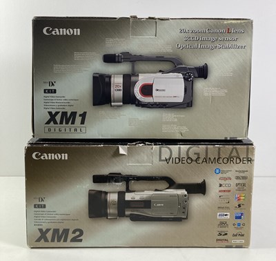 Lot 203 - CANON DIGITAL CAMCORDERS - XM1 AND XM2.