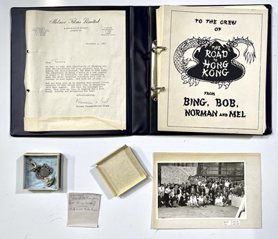 Lot 125 - THE ROAD TO HONG KONG (1962) - CAST AND CREW ISSUED MEMORABILIA INC THANK YOU FOLDER / BING CROSBY KEYRING / BOB HOPE CUFFLINKS.