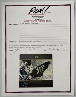 Lot 308 - U2 - FULLY SIGNED 7" SLEEVE.