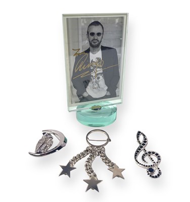 Lot 122 - THE BEATLES - COSTUME JEWELLERY OWNED BY RINGO STARR AND BARBARA BACH AND WITH TWICE SIGNED RINGO POSTCARD.