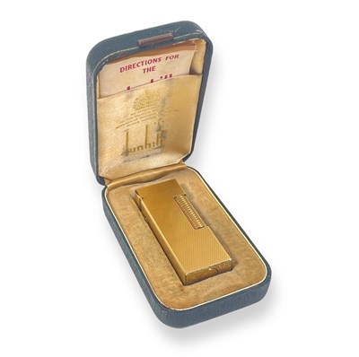 Lot 123 - THE BEATLES - A DUNHILL LIGHTER GIFTED BY JOHN LENNON AND YOKO ONO TO ENGINEER MALCOLM DAVIES.