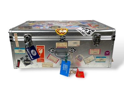 Lot 525 - JULIAN LENNON INTEREST - A TRAVEL CASE ADORNED WITH VARIOUS TOUR PASSES AND STICKERS.