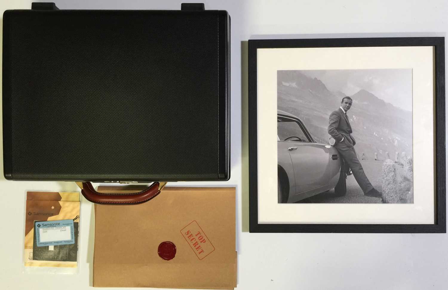 Lot 142 - JAMES BOND SAMSONITE PROMOTIONAL BRIEFCASE TOMORROW NEVER DIES & SEAN CONNERY FRAMED PHOTOGRAPH