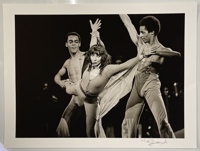 Lot 131 - KATE BUSH - PERFORMING 'KITE' LIVE - PHOTOGRAPHER SIGNED HIGH-QUALITY PHOTO PRINT.