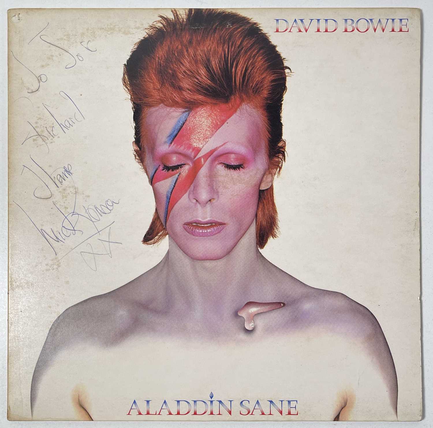 Lot 284 - DAVID BOWIE - A COPY OF ALADDIN SANE SIGNED BY DAVID BOWIE AND MICK RONSON.