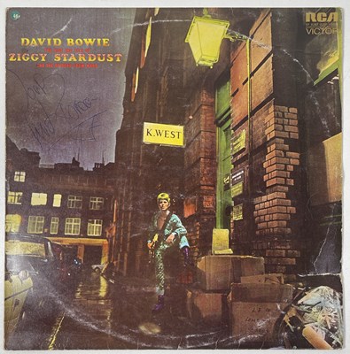 Lot 283 - DAVID BOWIE - A COPY OF ZIGGY STARDUST SIGNED BY DAVID BOWIE AND MICK RONSON.