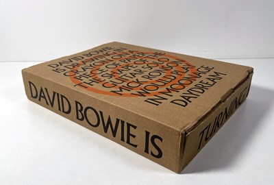 Lot 286 - DAVID BOWIE IS - LIMITED EDITION SIGNED BLACK PORTFOLIO EDITION.