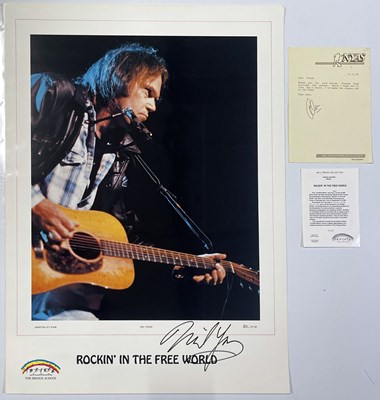 Lot 232 - NEIL YOUNG - A LIMITED EDITION ROCKIN' IN THE FREE WORLD SIGNED POSTER.