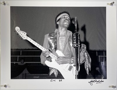 Lot 123 - JIMI HENDRIX - JOHN ROWLANDS SIGNED PHOTO PRINT.