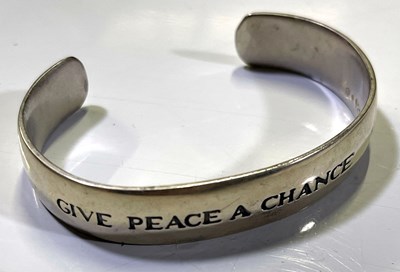 Lot 153 - THE BEATLES/ JOHN LENNON MEMORABILIA TO INC STERLING SILVER BANGLE AND HOHNER HARMONICA.