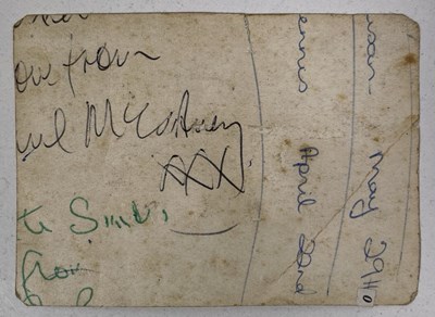 Lot 332 - THE BEATLES - CUTTING FROM AN ORIGINAL PHOTOGRAPH WITH PARTIAL SIGNATURES OF MCCARTNEY / LENNON.