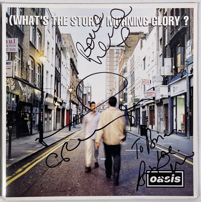 Lot 40 - OASIS - SIGNED COPY OF 'WHAT'S THE STORY...'