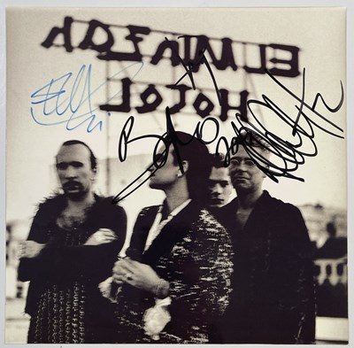 Lot 293 - U2 - FULLY SIGNED GROUP IMAGE.