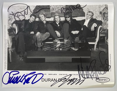 Lot 492 - DURAN DURAN - SIGNED 8X10" PHOTO.