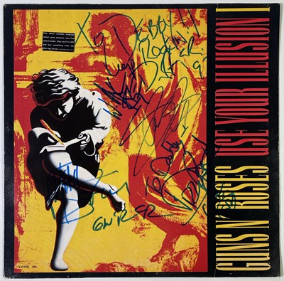 Lot 270 - GUNS N ROSES - FULLY SIGNED COPY OF 'USE YOUR ILLUSION'.