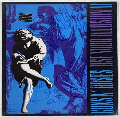 Lot 346 - GUNS N ROSES - SIGNED COPY OF 'USE YOUR ILLUSION'.