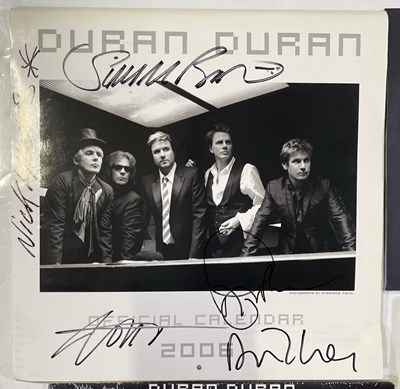 Lot 2310503 - DURAN DURAN - FULLY SIGNED CALENDAR AND VIP MEMORABILIA.