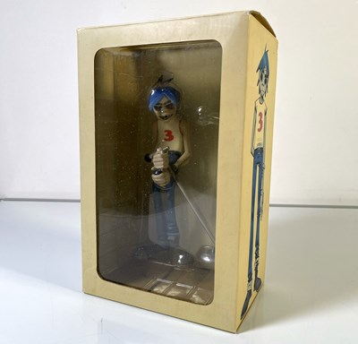 Lot 299 - BLUR/GORILLAZ - COLLECTABLE GORILLAZ KID ROBOT DOLL BOX SIGNED BY DAMON ALBARN AND JAMIE HEWLETT.